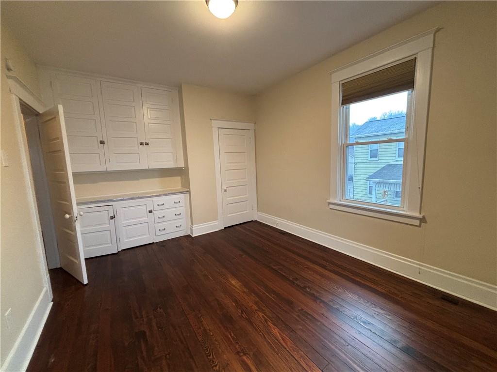 501 Atlantic Avenue Monaca, PA 15061 - Photo 24 of 29 a view of an empty room with wooden floor and a window