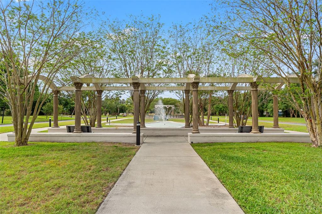 2295 Mexican Way, Unit 41 Clearwater, FL 33763 - Photo 27 of 41 a front view of a building with a garden and trees