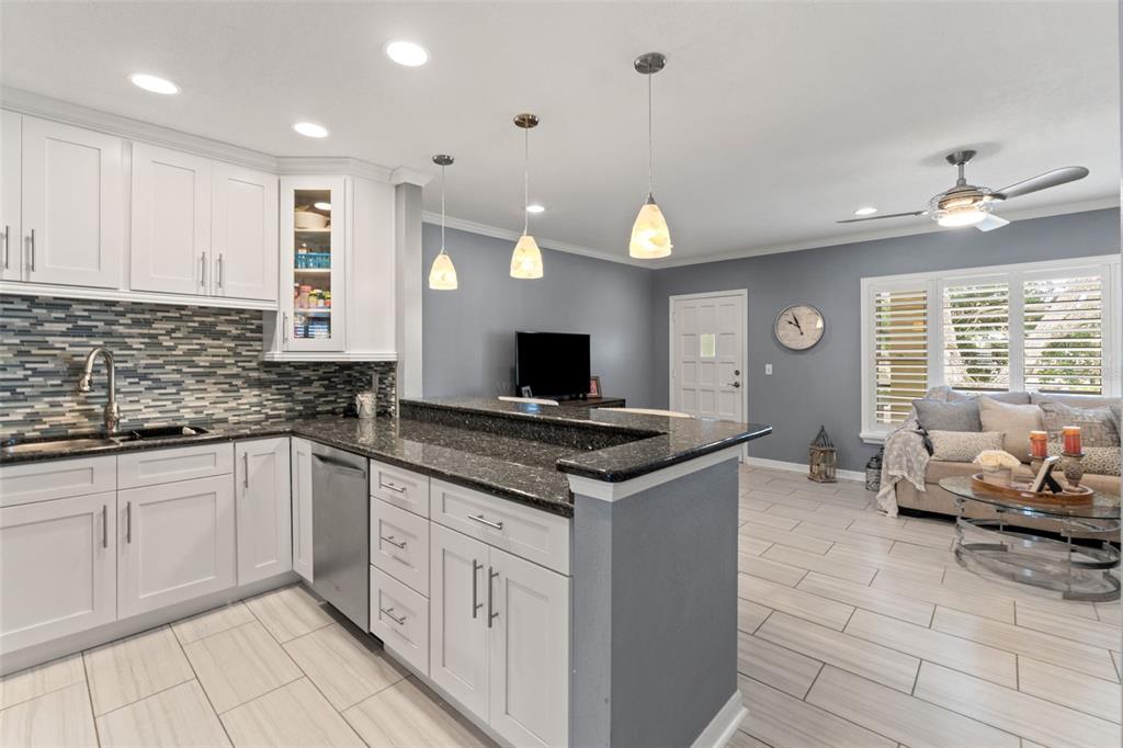 2295 Mexican Way, Unit 41 Clearwater, FL 33763 - Photo 8 of 41 a kitchen with stainless steel appliances granite countertop a stove and a sink