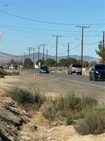 a view of car parked on the side of the road