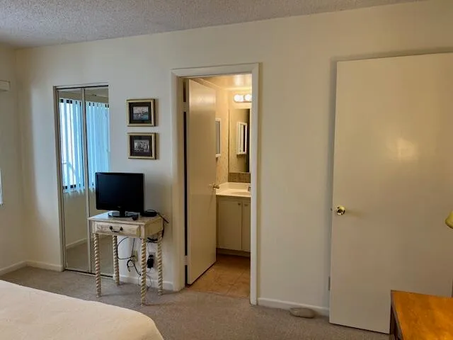 a view of a livingroom with a flat screen tv and a window
