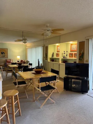 a room with lots of chairs and appliances