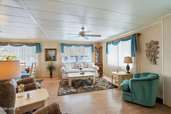 a living room with furniture and a large window