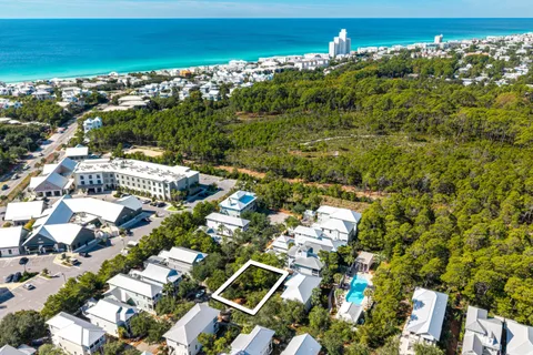 a sign that is sitting in front of flowers