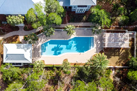 a view of a swimming pool with chairs