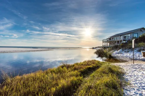 a view of a terrace with dining table and chairs