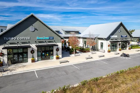 an aerial view of a house with outdoor space
