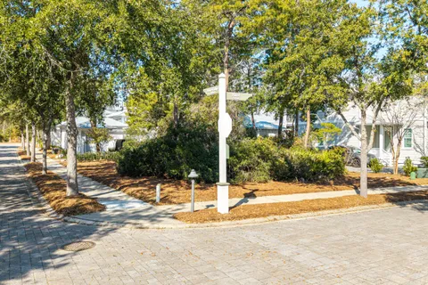a backyard of a house with large trees