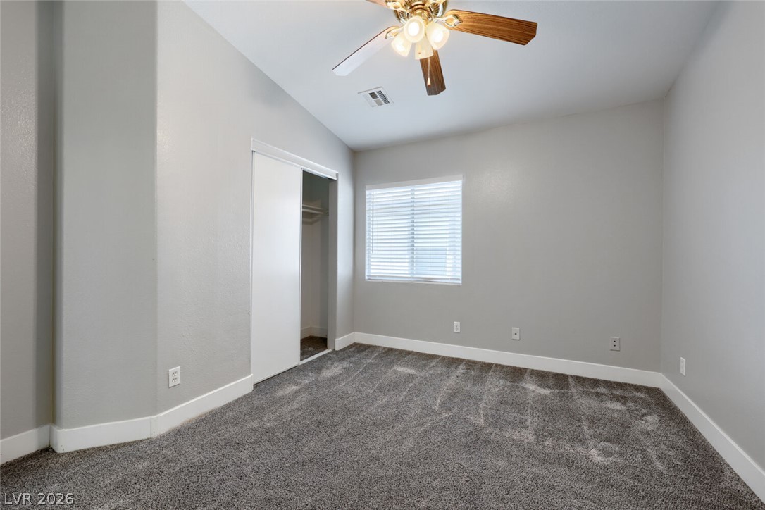 5985 High Steed Street, Unit 101 Henderson, NV 89011 - Photo 24 of 38 A restful bedroom offers vaulted ceilings and soft carpeting, perfect for peaceful slumber.