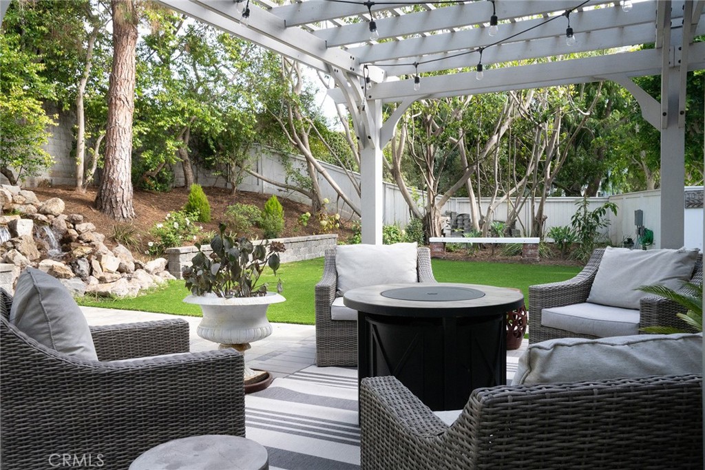 22 Chelsea Dana Point, CA 92629 - Photo 30 of 40 a view of a patio with couches chairs and a yard
