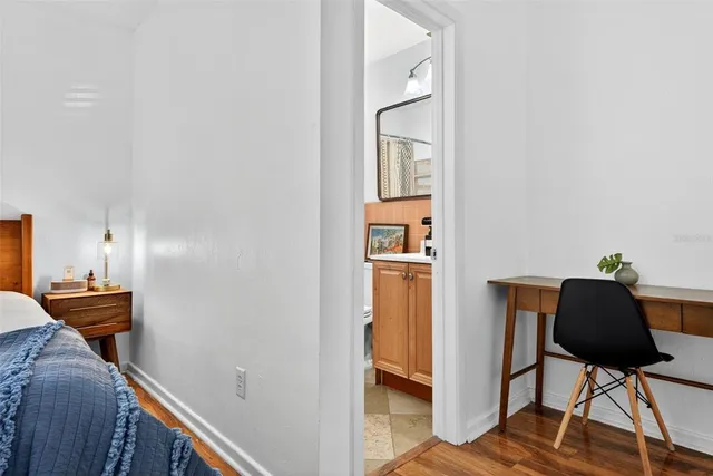 a bathroom with a toilet a sink and a window