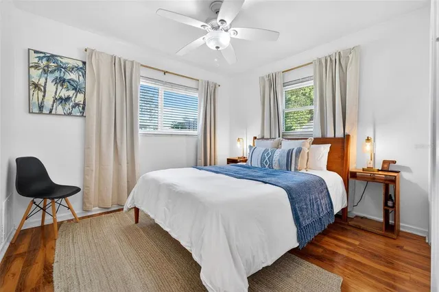 a view of a patio with a table and chairs under an umbrella