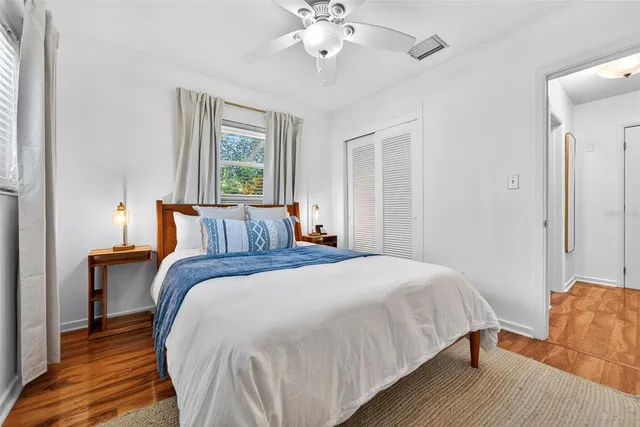 a view of a backyard with large tree