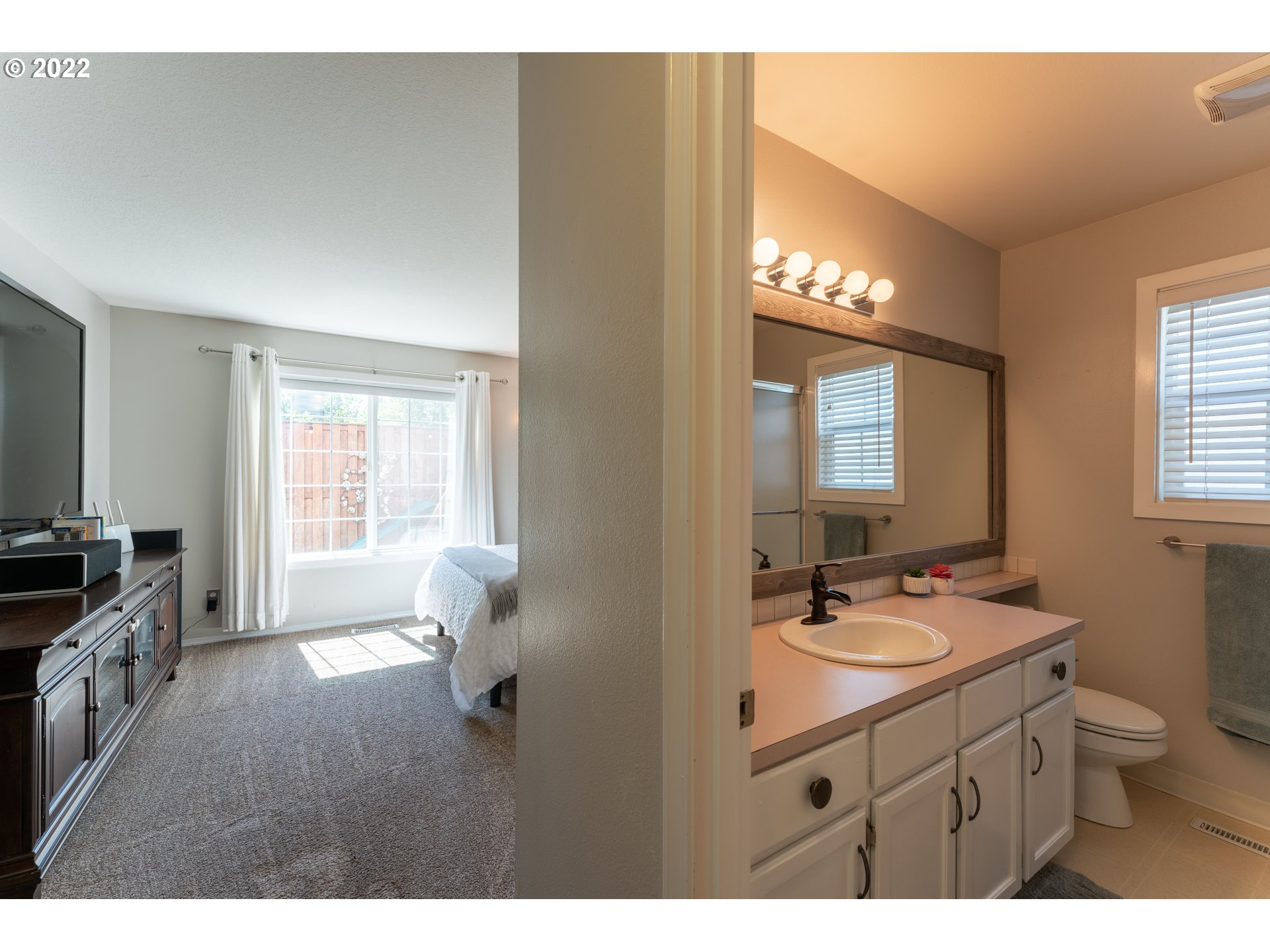 10594 Southwest Windsor Court Tigard, OR 97223 - Photo 11 of 31 a bathroom with a double vanity sink a toilet a mirror and window