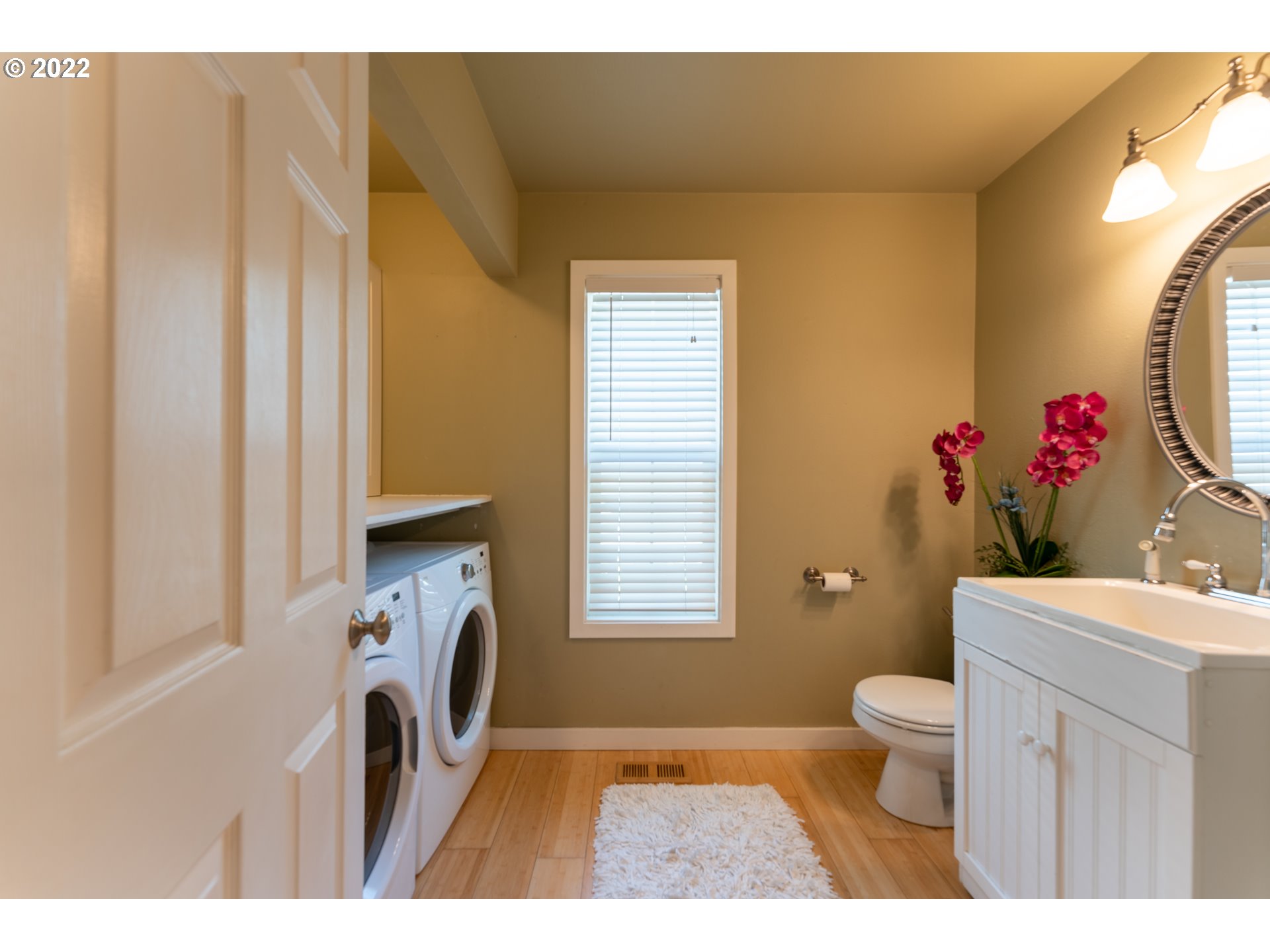 10594 Southwest Windsor Court Tigard, OR 97223 - Photo 14 of 31 a bathroom with a toilet a sink and a mirror