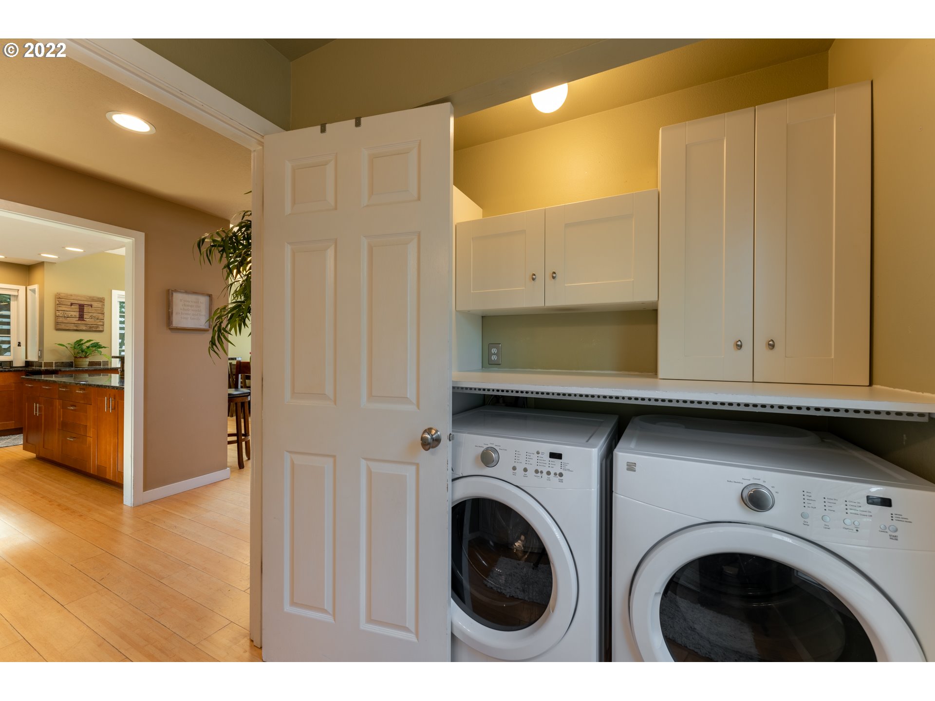 10594 Southwest Windsor Court Tigard, OR 97223 - Photo 16 of 31 a view of kitchen and utility room with washer and dryer