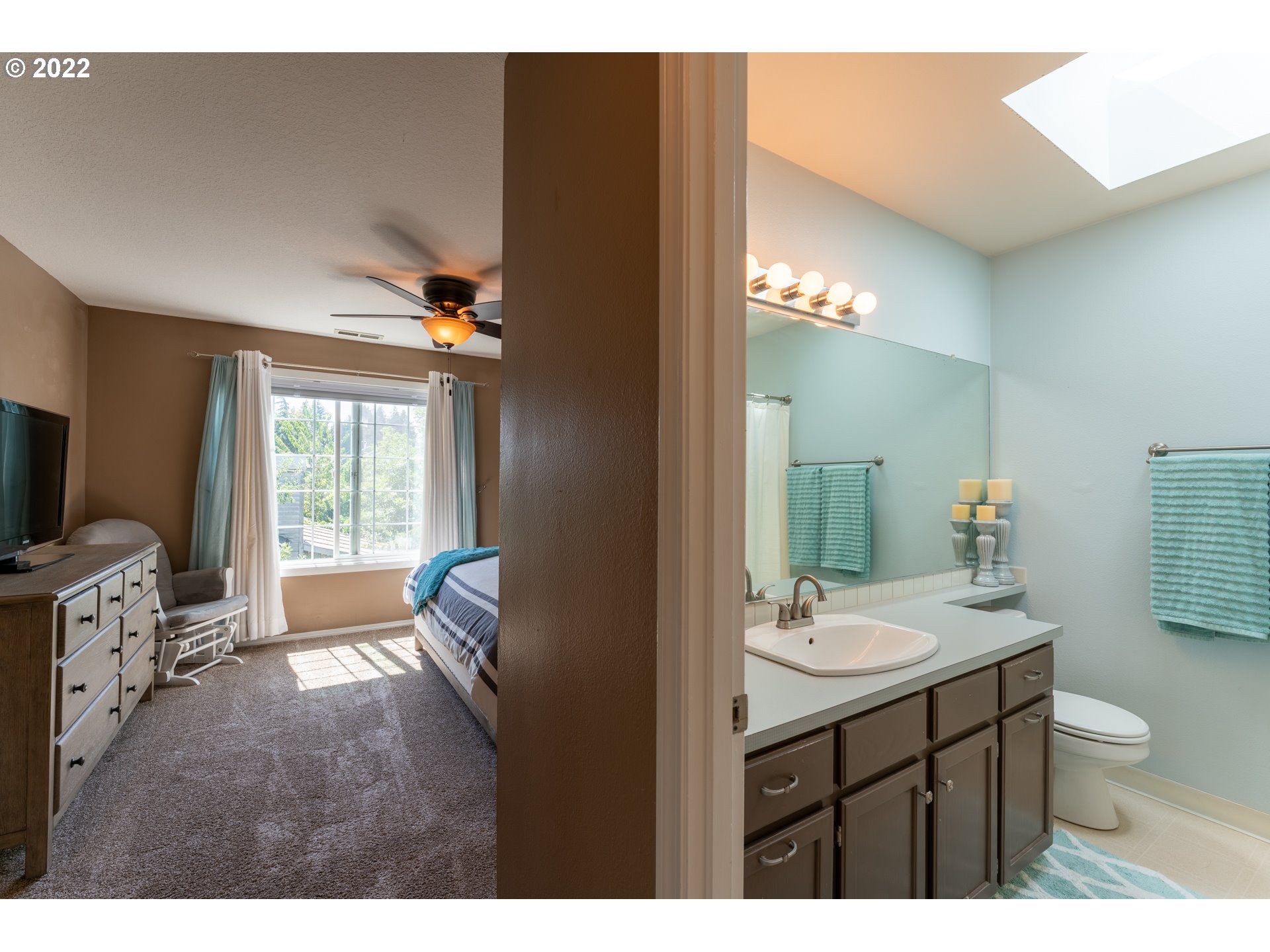 10594 Southwest Windsor Court Tigard, OR 97223 - Photo 18 of 31 a bathroom with a sink a vanity and a mirror
