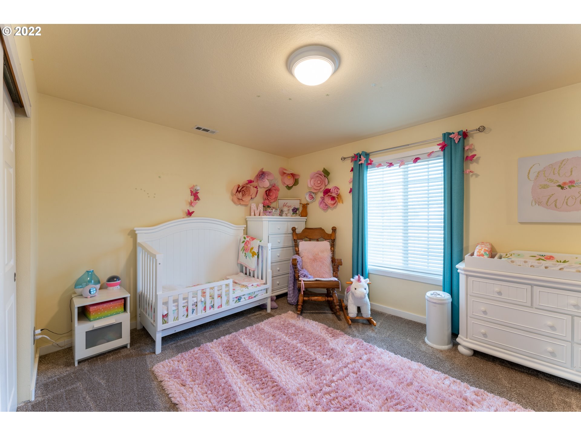 10594 Southwest Windsor Court Tigard, OR 97223 - Photo 22 of 31 a bedroom with a bed and wooden floor