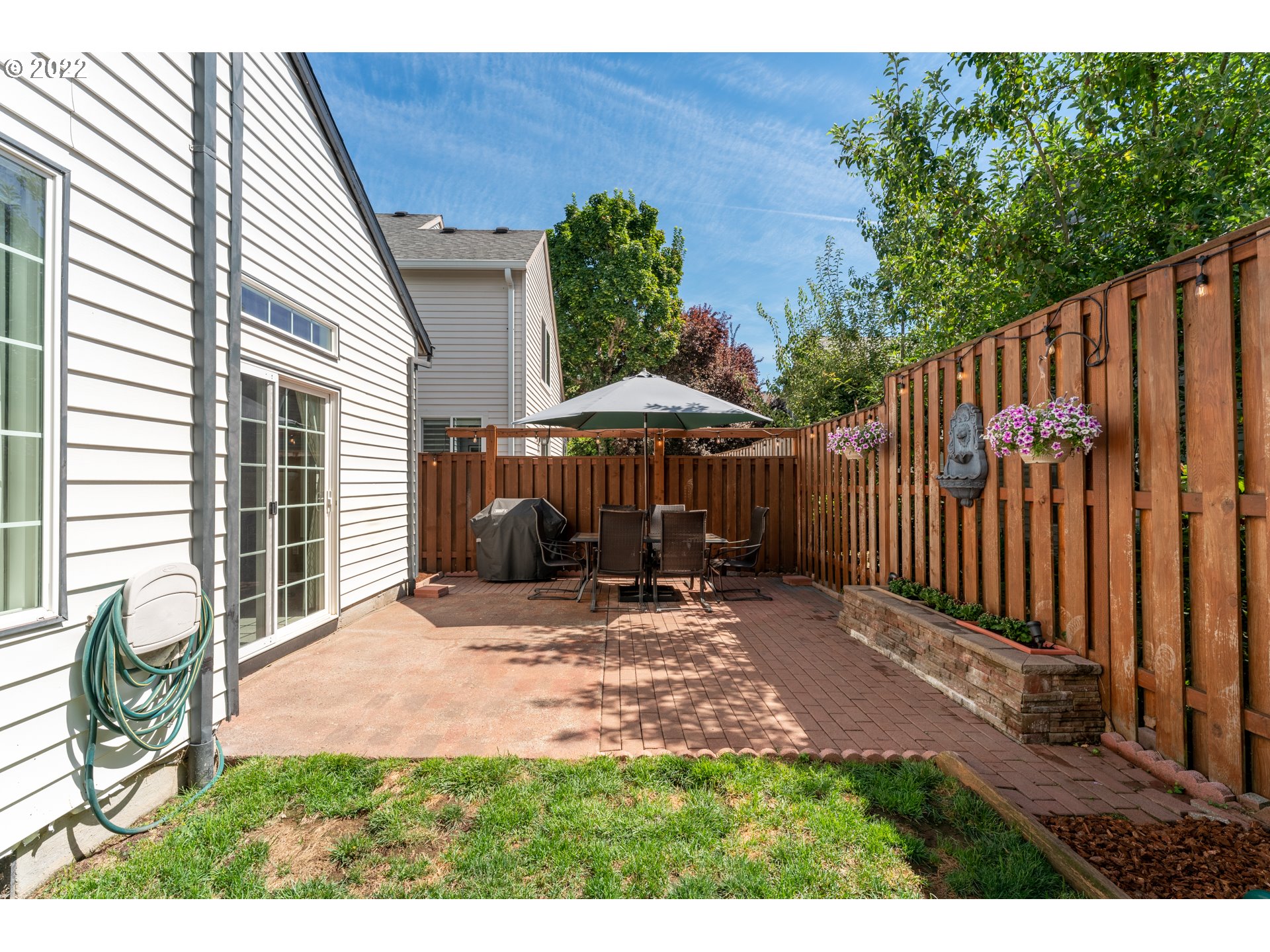 10594 Southwest Windsor Court Tigard, OR 97223 - Photo 26 of 31 a view of a backyard with a small cabin and wooden fence