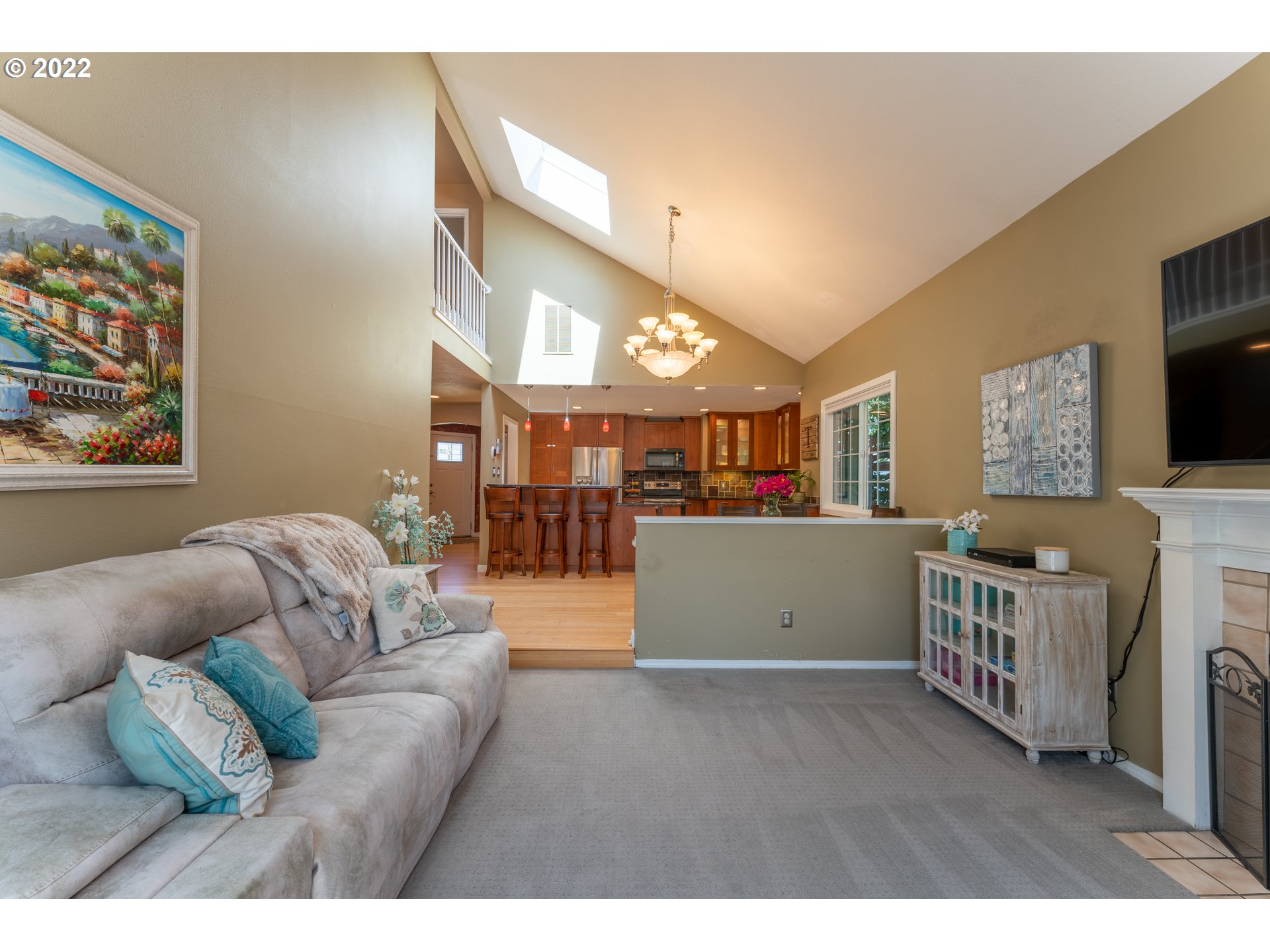 10594 Southwest Windsor Court Tigard, OR 97223 - Photo 10 of 31 a living room with furniture and a flat screen tv