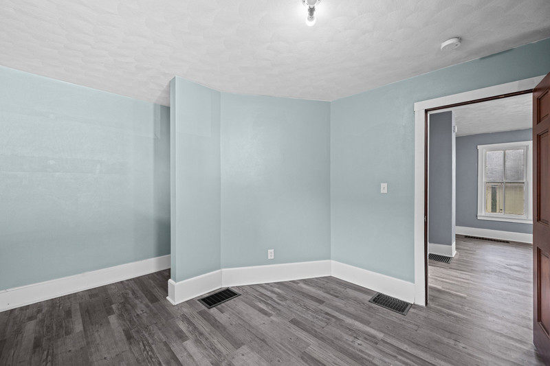 1419 17th Street Moline, IL 61265 - Photo 16 of 28 a view of an empty room with wooden floor