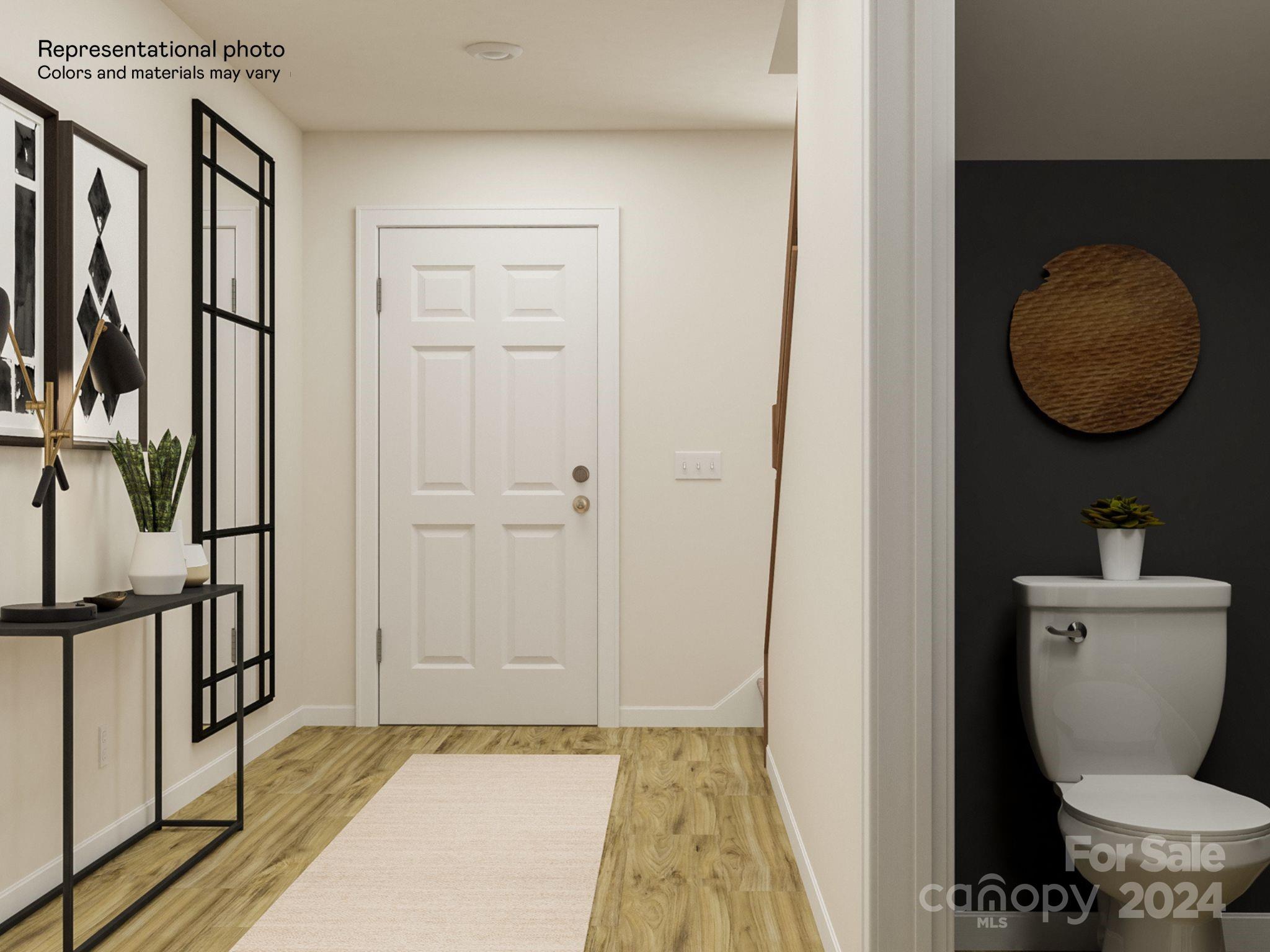15229 Windy Plns Road Charlotte, NC 28262 - Photo 26 of 28 a bathroom with a toilet and a mirror