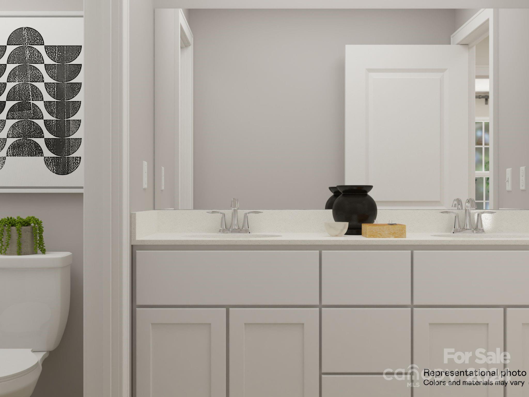 15229 Windy Plns Road Charlotte, NC 28262 - Photo 3 of 28 a bathroom with a sink and a toilet