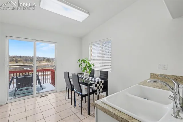 a bedroom with a bed couch and a window