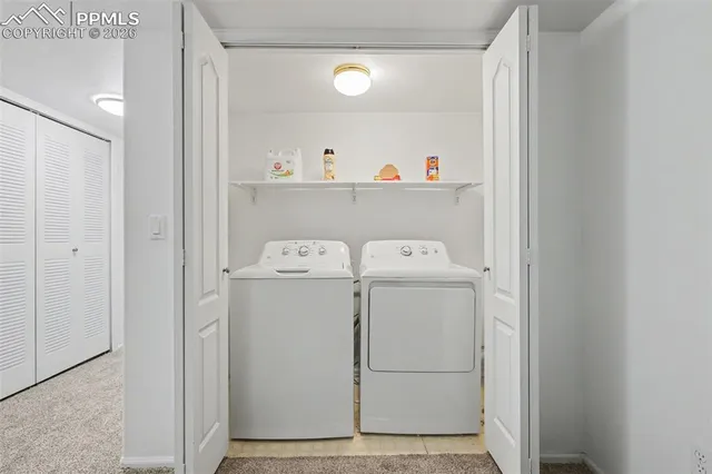 a living room with furniture and a gym