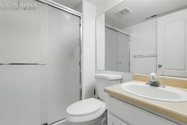 a view of a balcony with wooden floor and city view