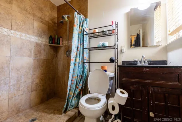 a view of a bathroom from a hallway