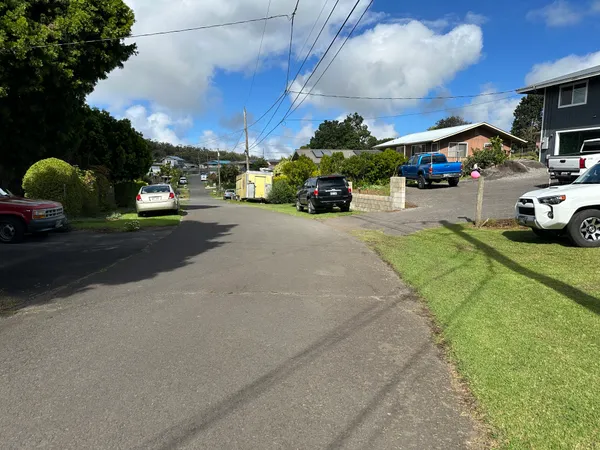 a view of street with parked cars