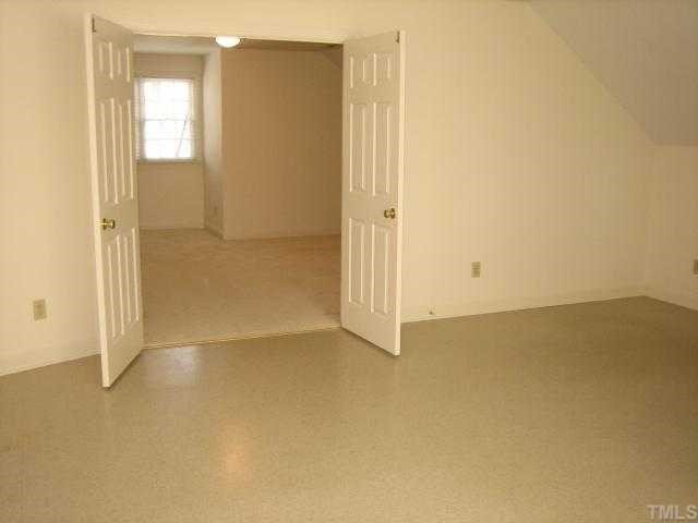 7928 Rooksley Court Raleigh, NC 27615 - Photo 12 of 12 Large bonus is actually two rooms! Main bonus is carpeted. Double doors open to vinyl floored room with lots of light. Multi-purpose room could be exercise room, play room, study, hobby room (has wash sink) or--whatever!!!! Bonus Room