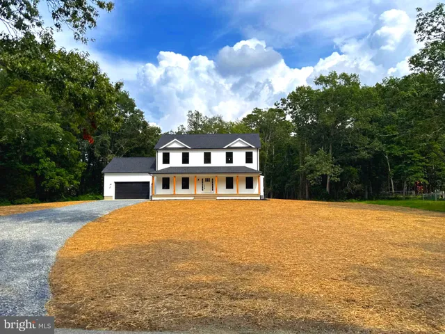 a house with trees in the background