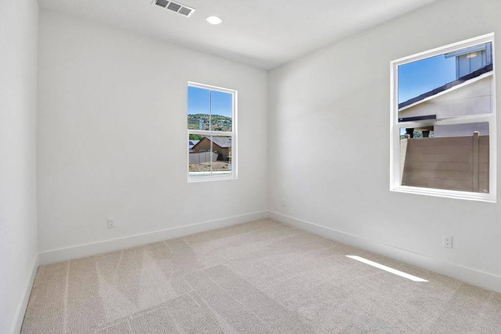 3521 Butler Place Escondido, CA 92027 - Photo 41 of 50 an empty room with windows
