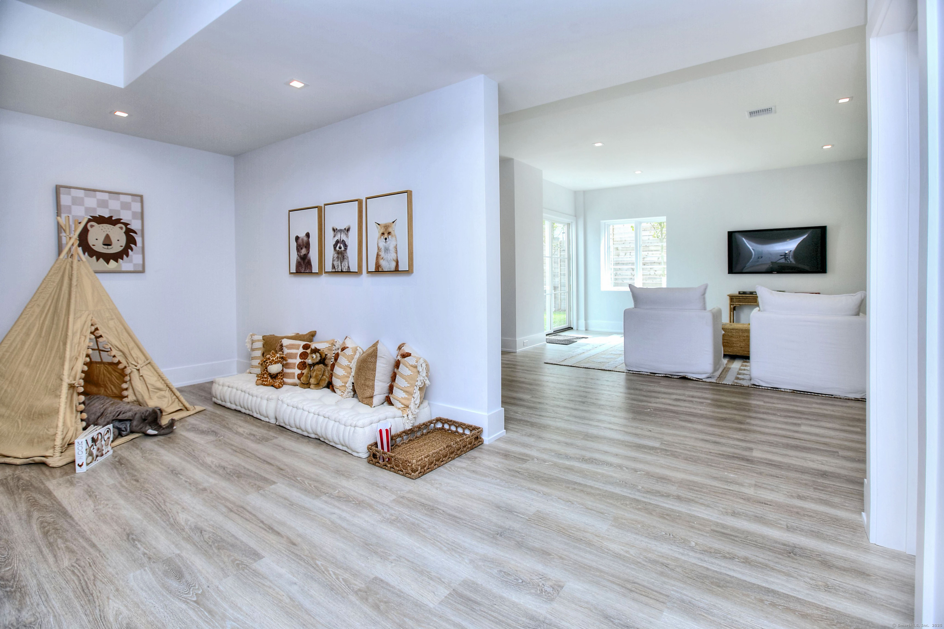 2 Webb Road Westport, CT 06880 - Photo 23 of 26 a view of a livingroom with furniture and a flat screen tv