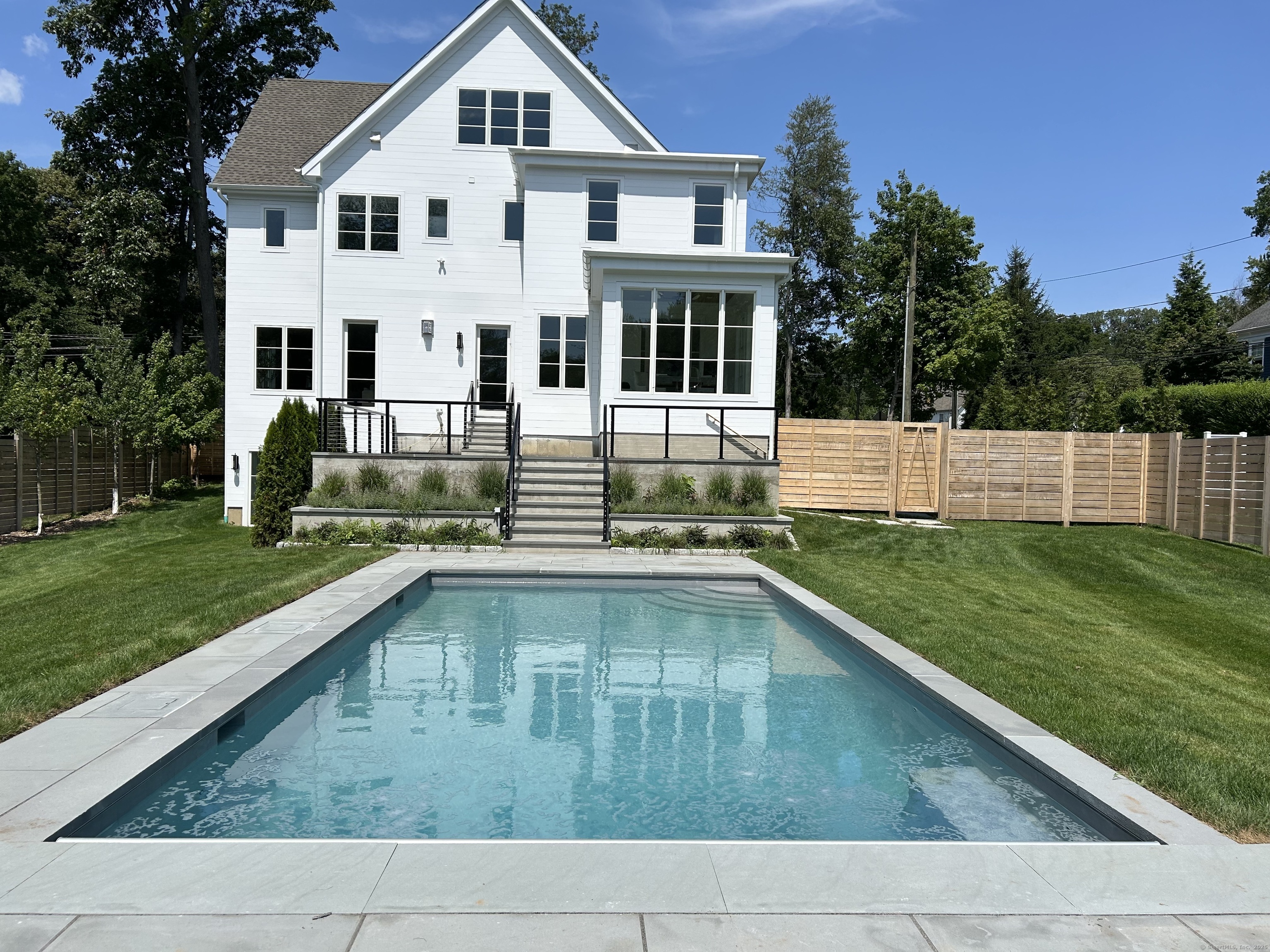 2 Webb Road Westport, CT 06880 - Photo 25 of 26 a house view with swimming pool and garden space