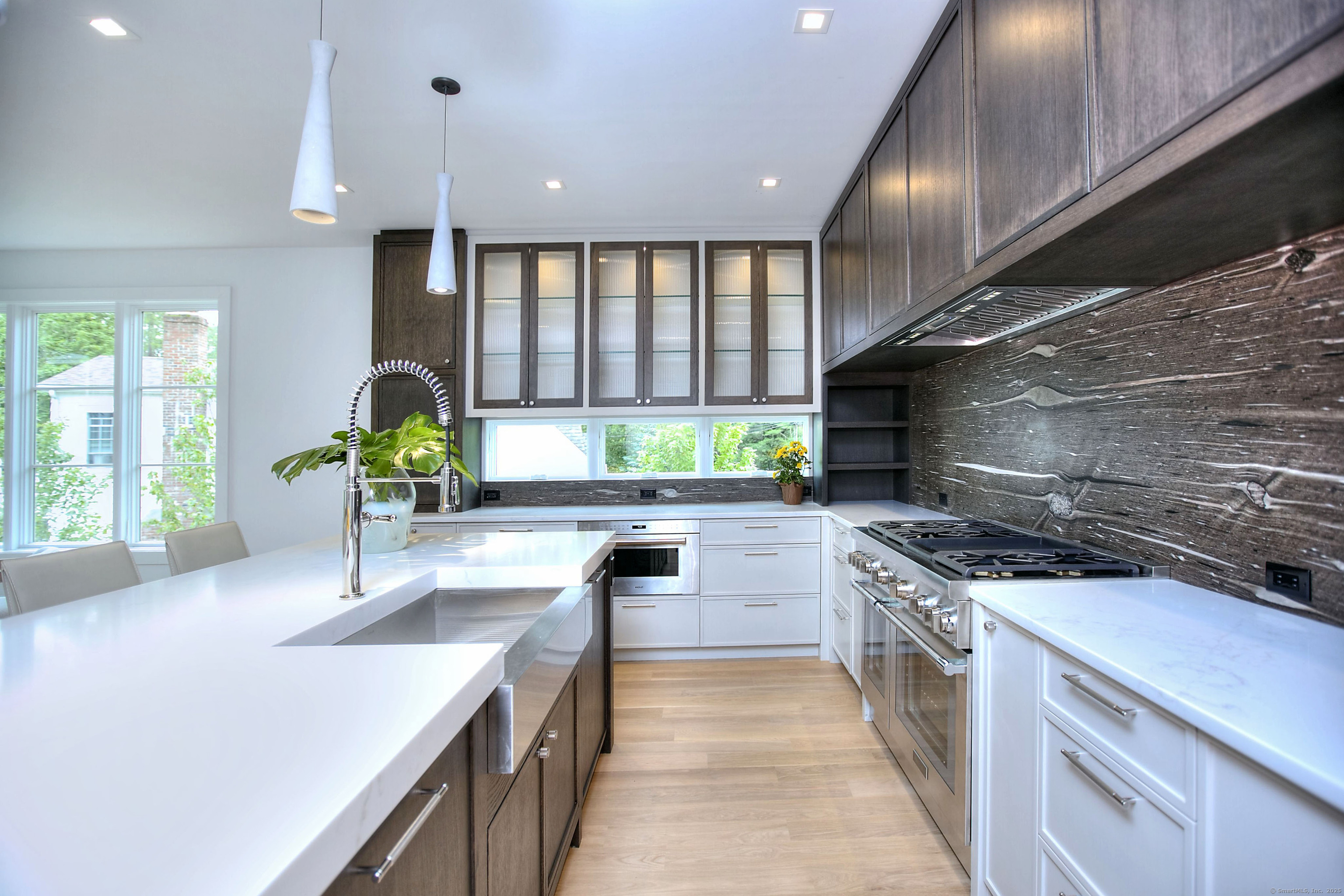 2 Webb Road Westport, CT 06880 - Photo 5 of 26 a kitchen with stainless steel appliances granite countertop a sink stove and cabinets
