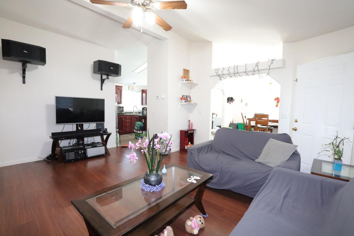 5450 Monterey Road, Unit 132 San Jose, CA 95111 - Photo 12 of 15 a living room with furniture and a flat screen tv