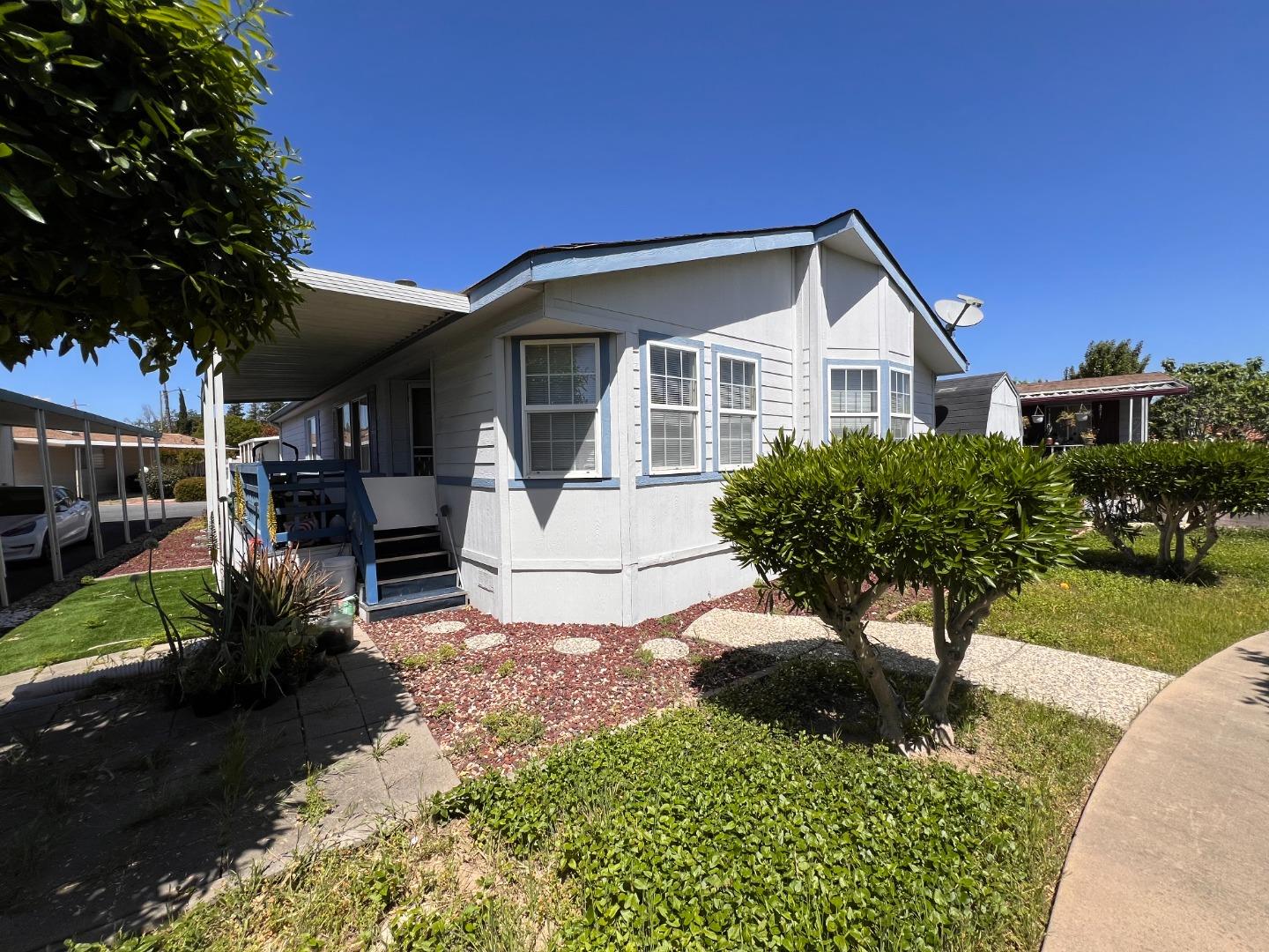 5450 Monterey Road, Unit 132 San Jose, CA 95111 - Photo 2 of 15 a front view of a house with a yard