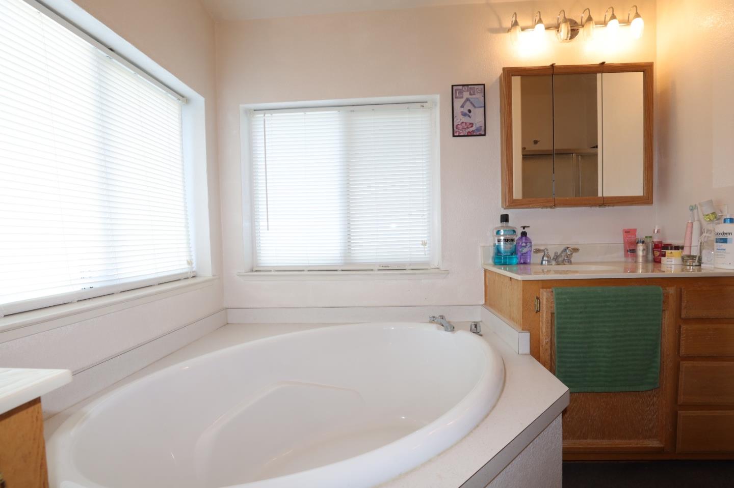5450 Monterey Road, Unit 132 San Jose, CA 95111 - Photo 4 of 15 a white bath tub sitting in a bathroom next to a window