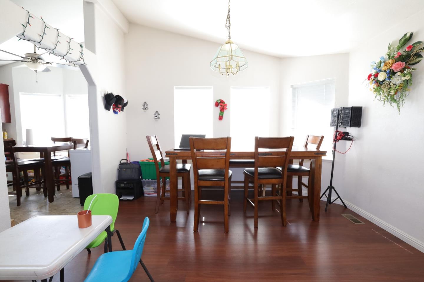 5450 Monterey Road, Unit 132 San Jose, CA 95111 - Photo 8 of 15 a view of a dining room with furniture wooden floor and chandelier