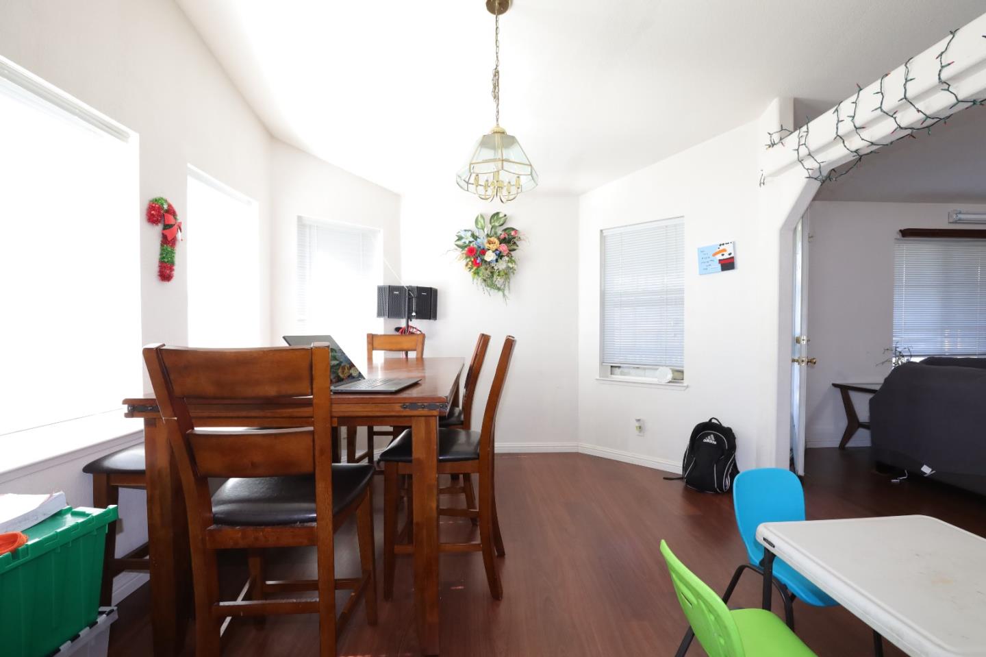 5450 Monterey Road, Unit 132 San Jose, CA 95111 - Photo 9 of 15 a view of a dining room with furniture and wooden floor