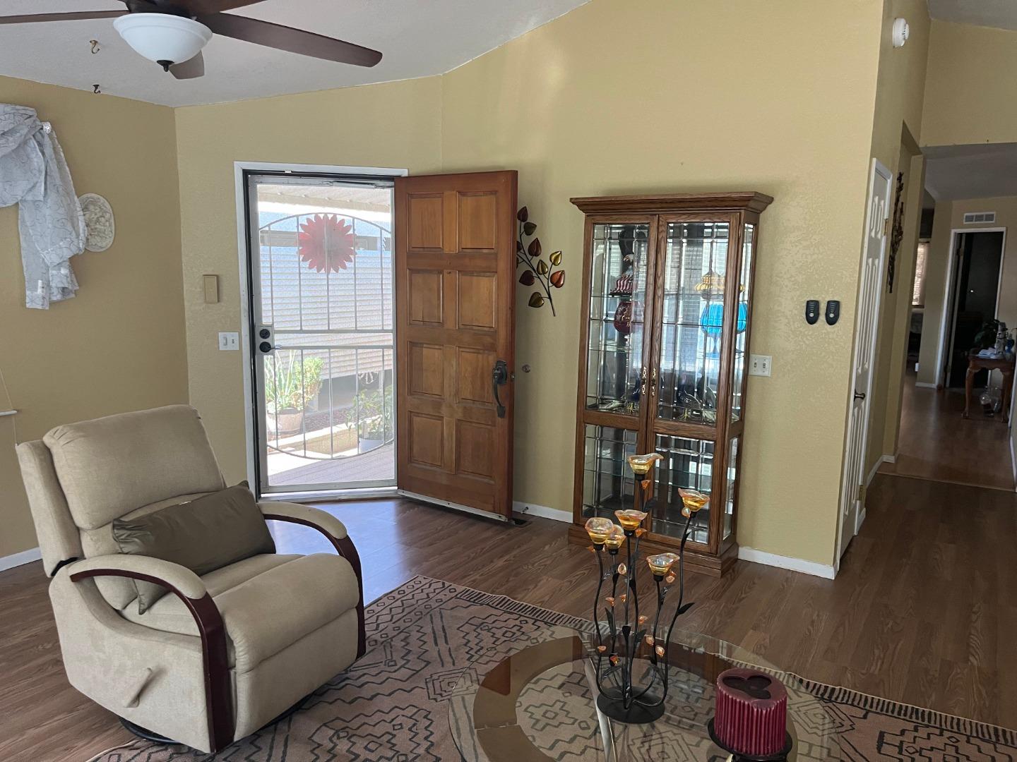 500 North Tully Road, Unit 39 Turlock, CA 95380 - Photo 17 of 32 a living room with furniture and wooden floor