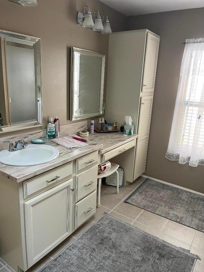 500 North Tully Road, Unit 39 Turlock, CA 95380 - Photo 23 of 32 a bathroom with a sink and a mirror
