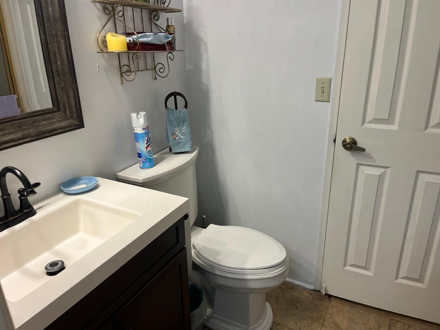 500 North Tully Road, Unit 39 Turlock, CA 95380 - Photo 25 of 32 a bathroom with a sink vanity and toilet