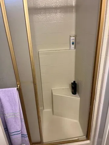 a bathroom with a sink and a shower