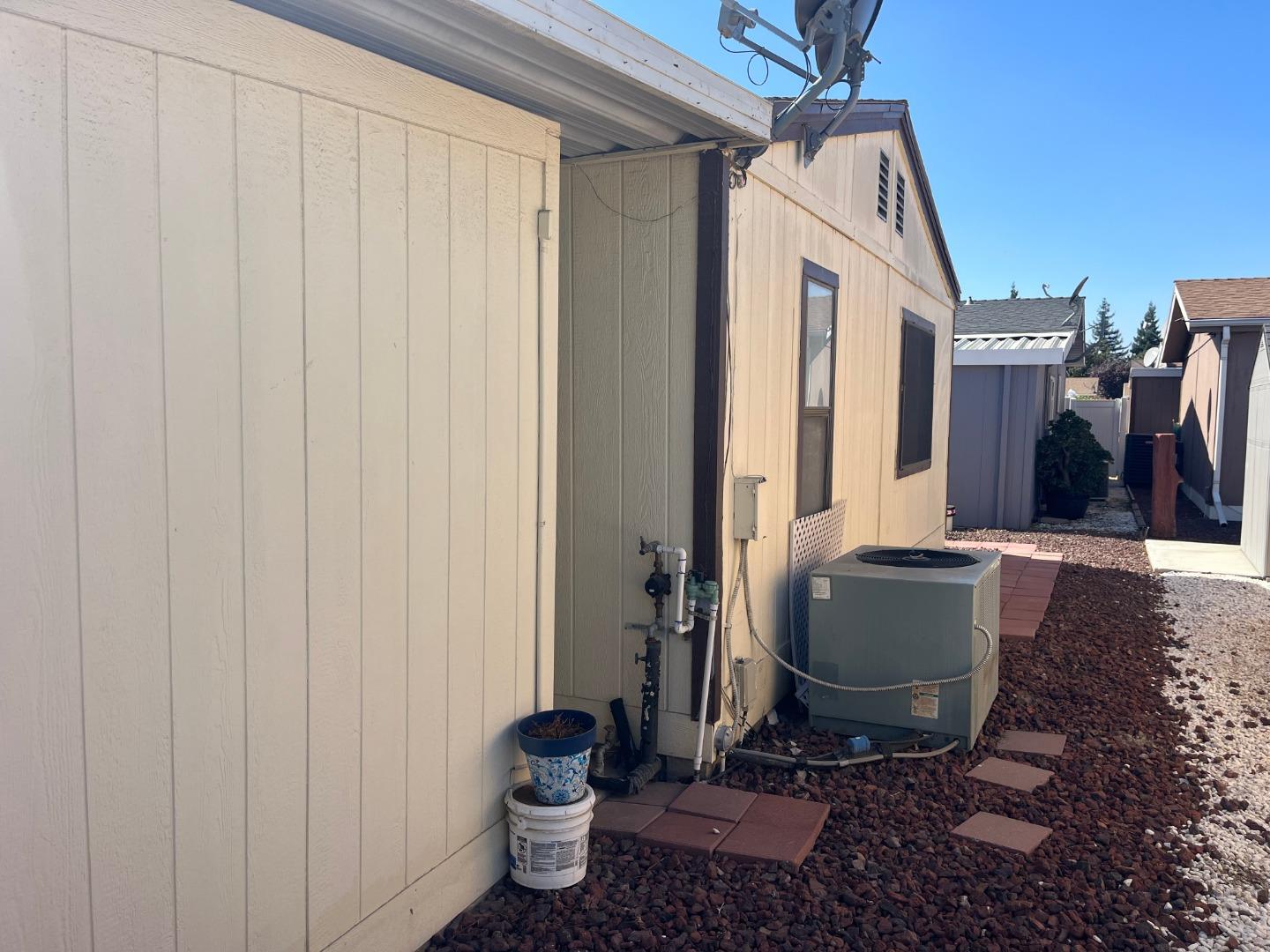500 North Tully Road, Unit 39 Turlock, CA 95380 - Photo 31 of 32 a bathroom with a toilet a sink and a mirror
