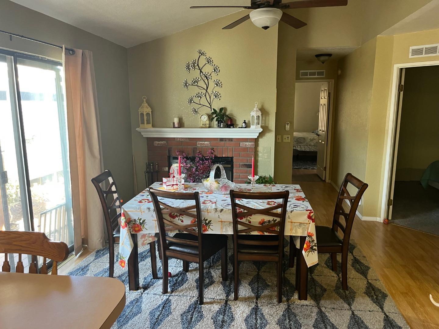 500 North Tully Road, Unit 39 Turlock, CA 95380 - Photo 8 of 32 a view of a dining room with furniture and wooden floor