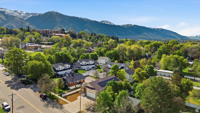 560 East 700 North Logan, UT 84321 - Photo 28 of 32 Aerial perspective featuring a residential area with a prominent mountain backdrop